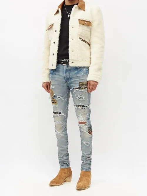 AMIRI BIKER PATCH DISTRESSED SKINNY JEANS